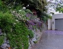 Dry-packed stone retaining walls allow for vertical inter-planting